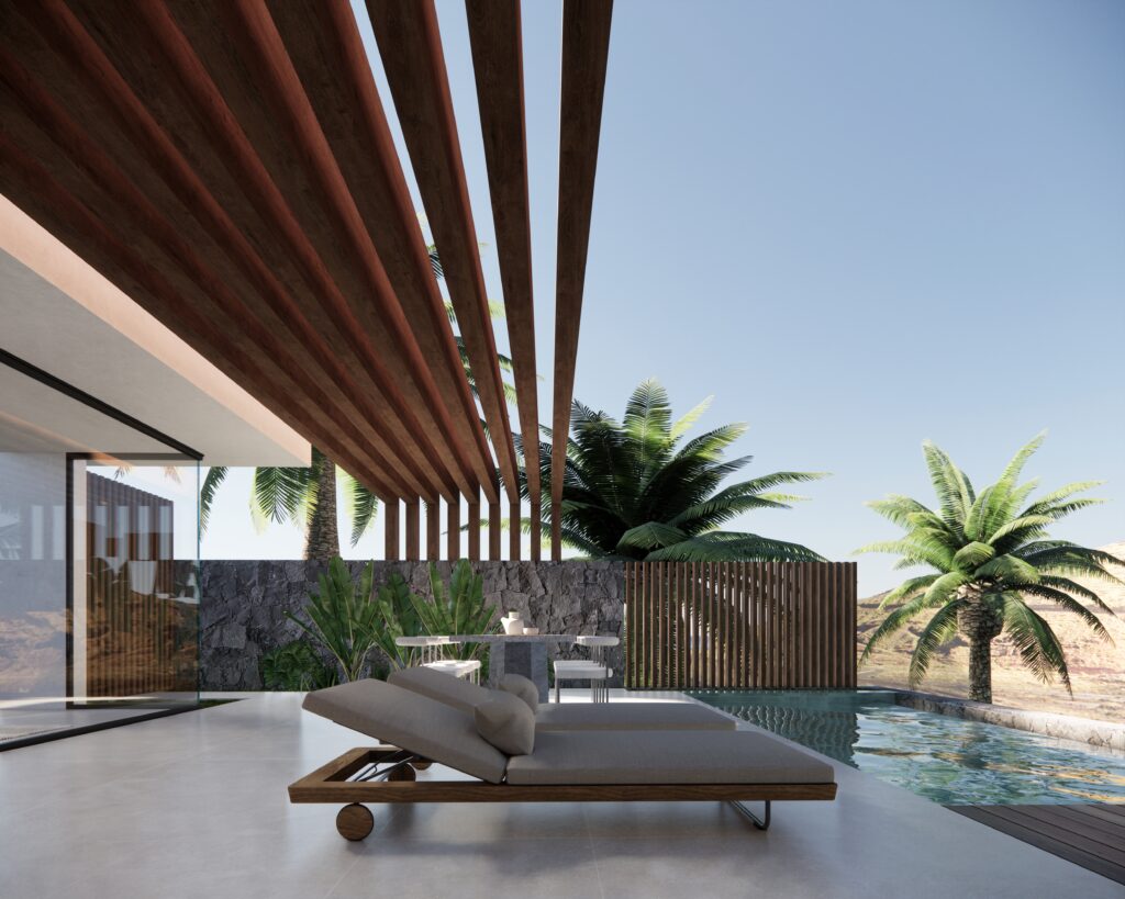 Sun-drenched terrace with volcanic stone walls, linen textiles and sweeping Atlantic views on the Canary Islands.